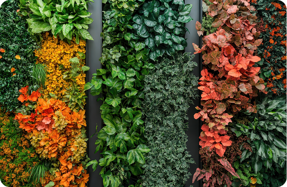 A stunning vertical garden wall featuring a rich mix of green, orange, and red foliage plants